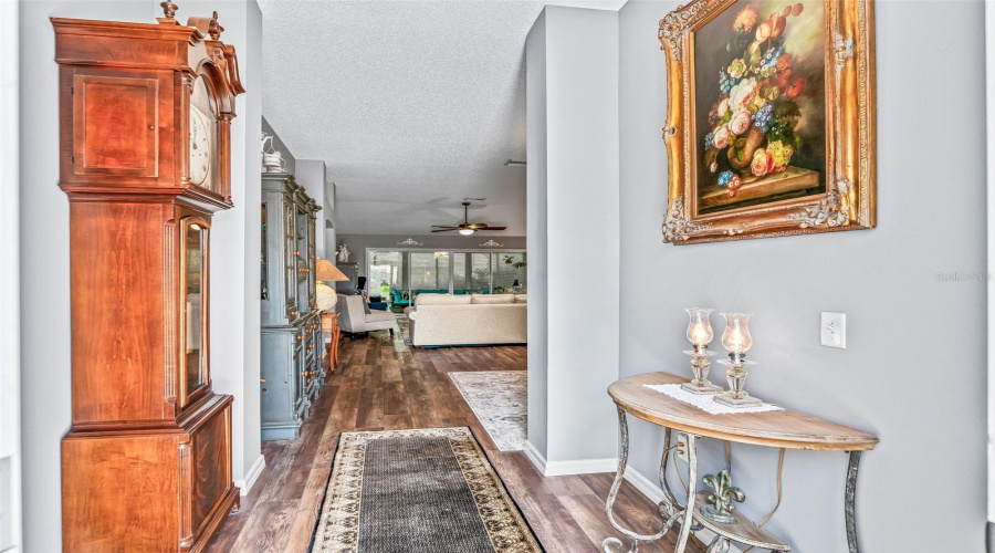 A Long, Inviting Foyer With Attractive Wood-Look High-End Lvp Flooring Provides A Clear Sightline Into The Home’s Open Living Spaces.