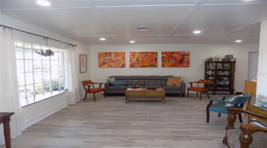 Spacious Front Living Room With Bay Window &Amp; Beadboard Ceiling With Recessed Lighting