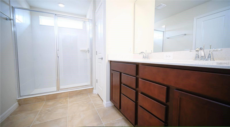 Primary Bathroom Has Spacious Vanity For All Of Our Products.