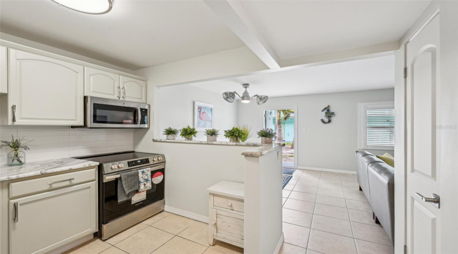 Kitchen Featuring Updated Appliances And Workspace