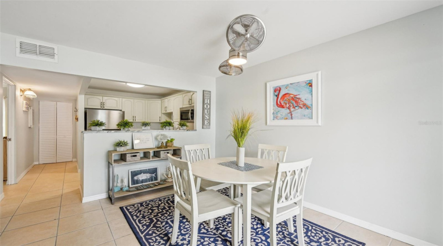 Dining Area Adjacent To Kitchen And Living Space