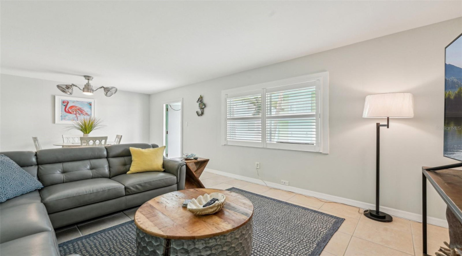 Living Room With Access To Dining And Kitchen Areas
