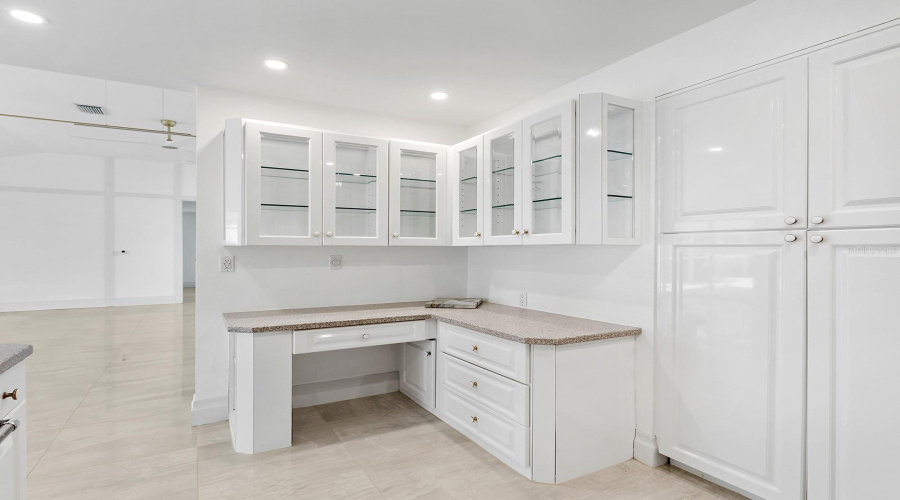 Kitchen Desk And Glassed Cabinets