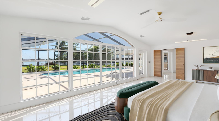 Main Bedroom Furnished With Views To Pool And Bay