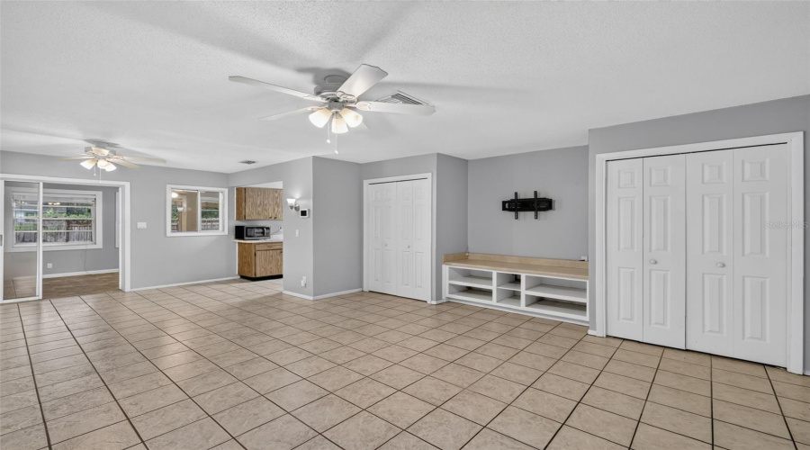 Open Living Space With Easy Flow Into The Kitchen And Florida Room