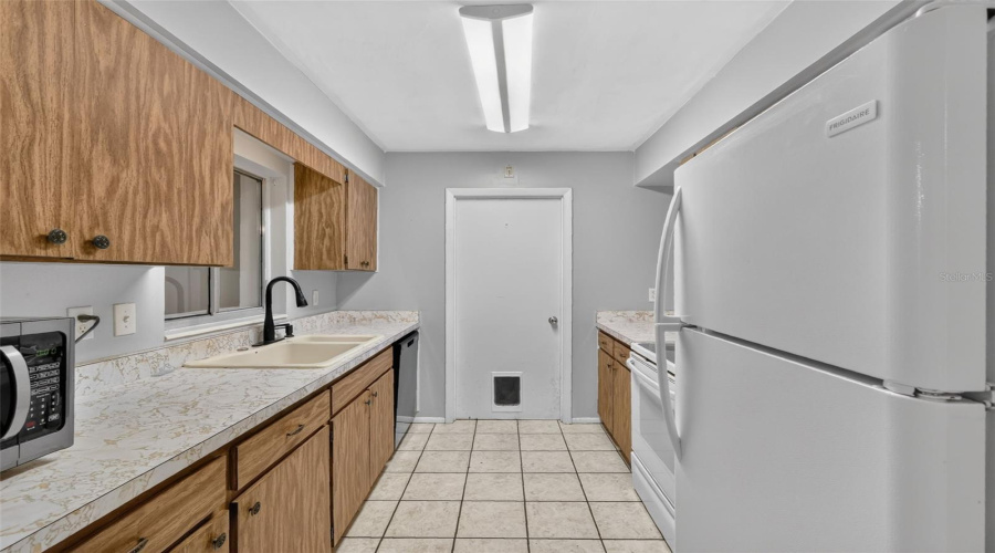 Galley-Style Kitchen With Ample Cabinet And Counter Space