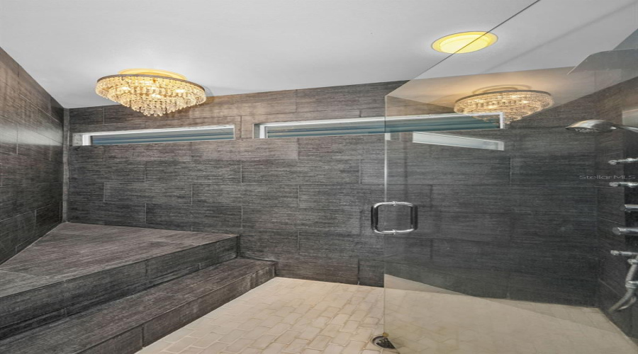 Master Shower With Bench And Chandelier