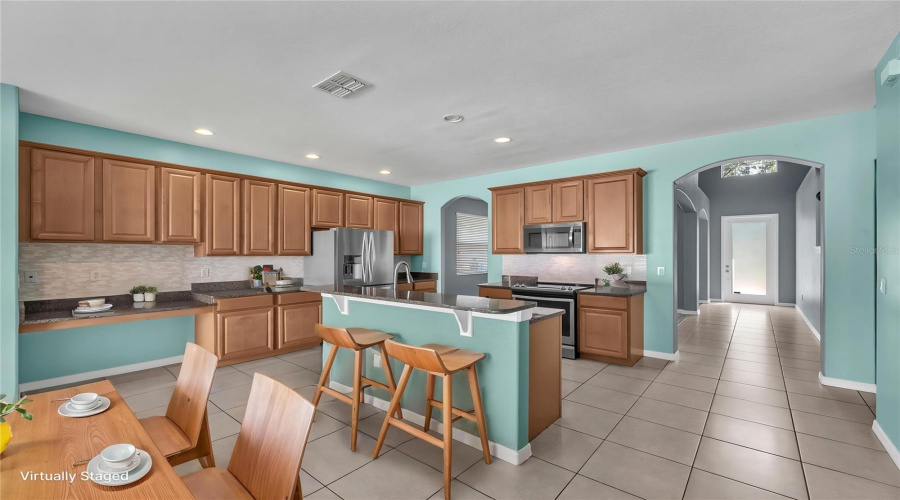 42-Inch Maple Cabinetry With Plenty Of Granite Work Surface.