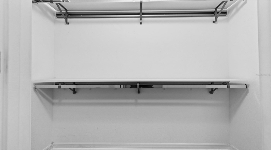 Primary-Walk-In Closet: Custom Shelving