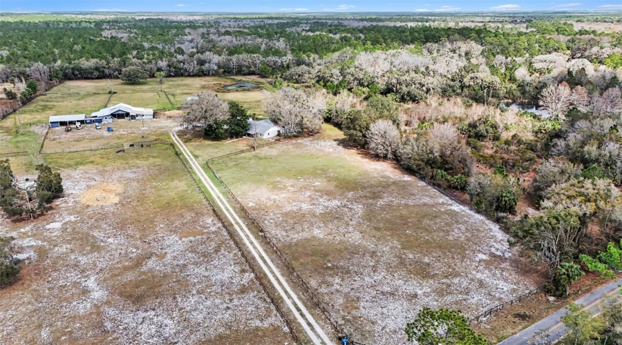 To The Left - Aerial View Of The Front Pasture And The House