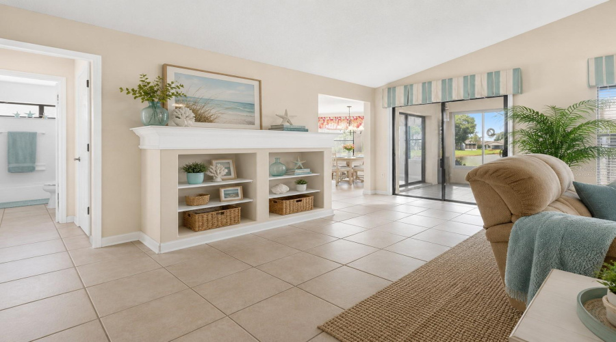 •  Living Room – Alternate View: Virtually Staged – Coastal Décor Highlights The Spacious Living Area, Vaulted Ceiling And Natural Light.