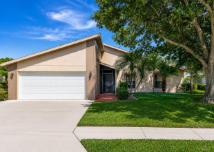 Front Exterior: Virtually Enhanced – Welcome to Park Forest! 411 Cypress Forest Dr. offers inviting curb appeal and a warm Florida welcome in this desirable 55+ community.