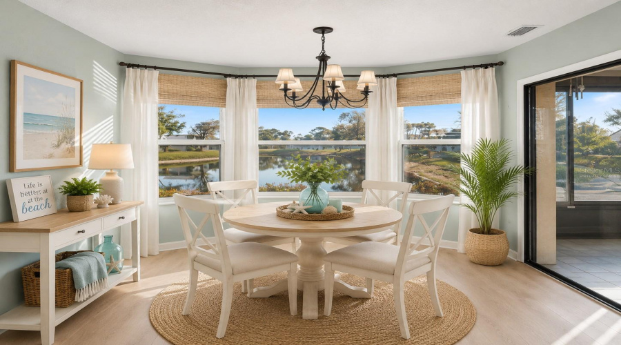•  Dining Area: Virtually Staged – Coastal-Inspired Dining Area Highlighting The Beautiful Water View And Abundant Natural Light.