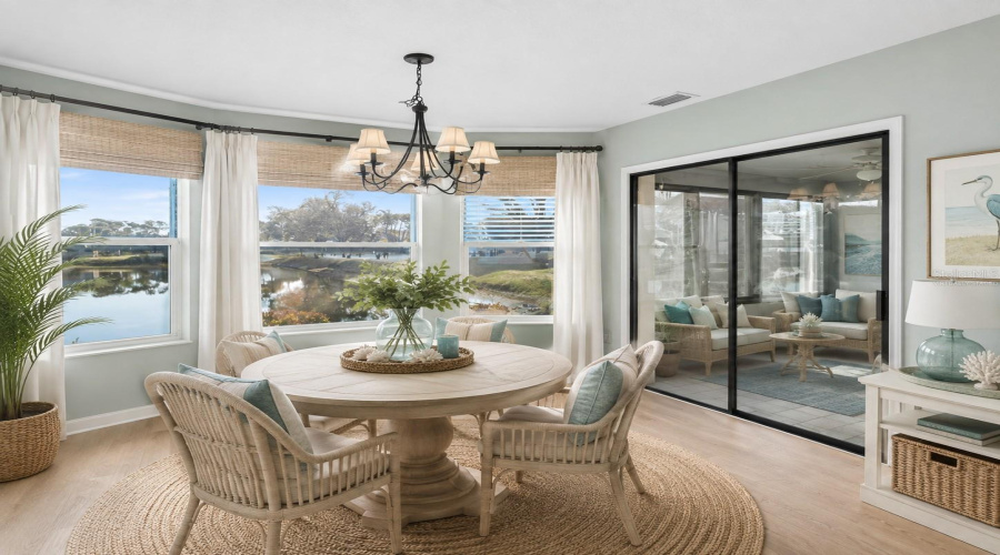•  Dining Area: Virtually Staged – Coastal-Inspired Dining Area Highlighting The Beautiful Water View And Abundant Natural Light.