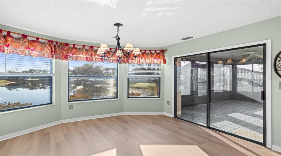 Dining Room Has New Luxury Vinly Flooring And Water View