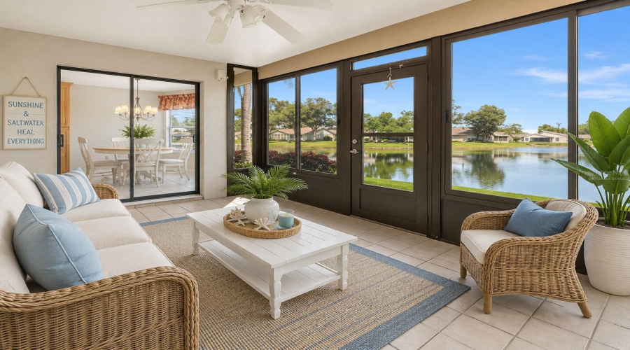 •  Florida Room/Lanai: Virtually Staged – Coastal-Inspired Florida Room Showcasing The Beautiful Water Views And Indoor-Outdoor Florida Lifestyle.
