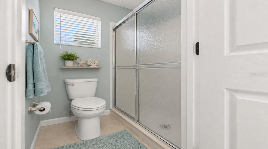 •  Primary Bath – Shower: Virtually Staged – Coastal Accents Add A Fresh, Relaxing Feel To The Primary Bath And Walk-In Shower Area.