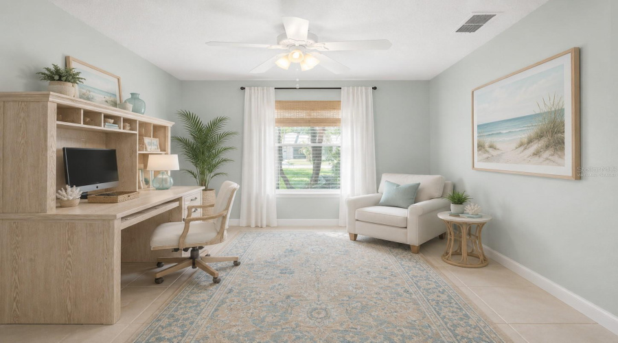 **Den/Office:** *Virtually Staged – Bright And Inviting Den/Office Enhanced With Coastal-Inspired Décor, Creating A Comfortable And Functional Workspace.