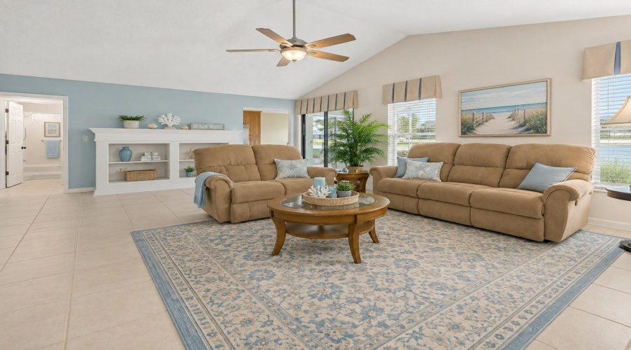 •  Living Room – Alternate View: Virtually Staged – Coastal Décor Highlights The Spacious Living Area, Vaulted Ceiling And Natural Light.