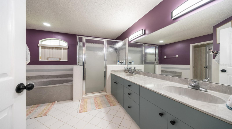 Owners Suite Bathroom With Tub And Shower