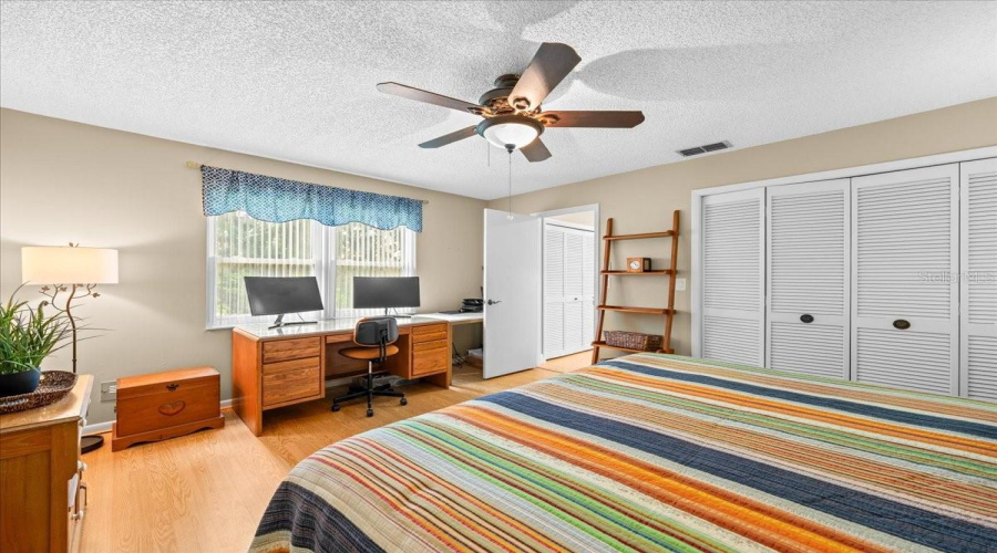 Large Guest Bedroom Off Back Hall With Reach In Closet. Shares Hall With Guest Bathroom.