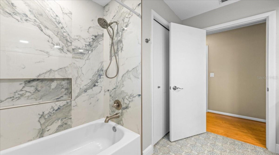 Updated Tub With Shower And Storage Niche