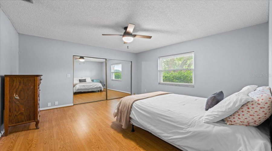 Large Bedroom With Mirrored Door Closet