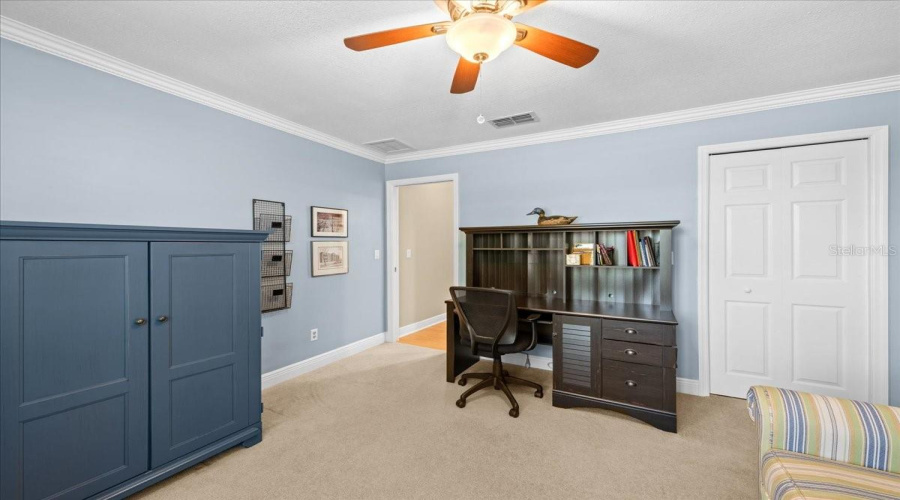 Bedroom Near Primary Bedroom Set Up As Office. Featuring Walk-In Closet.