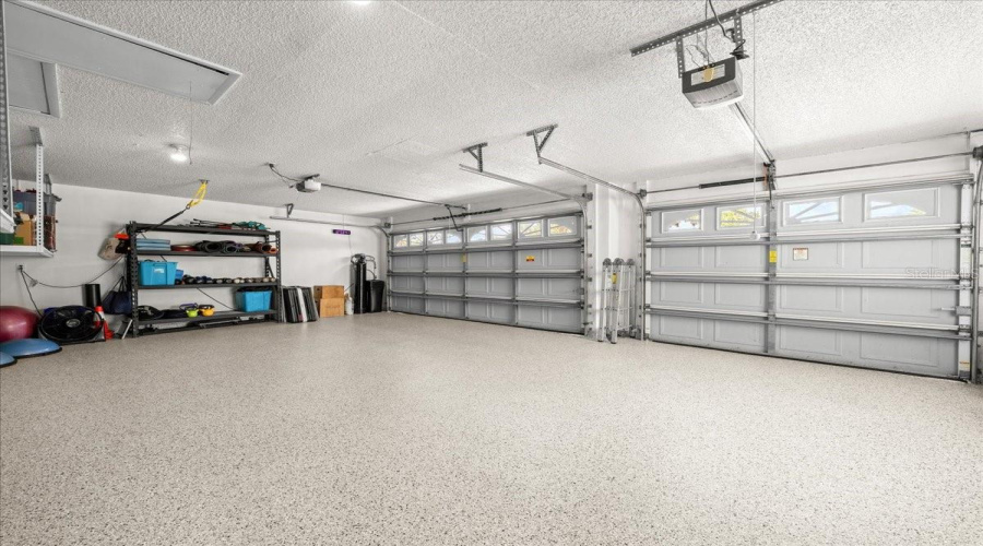 Three Car Garage With Polyaspartic Chip Floor.