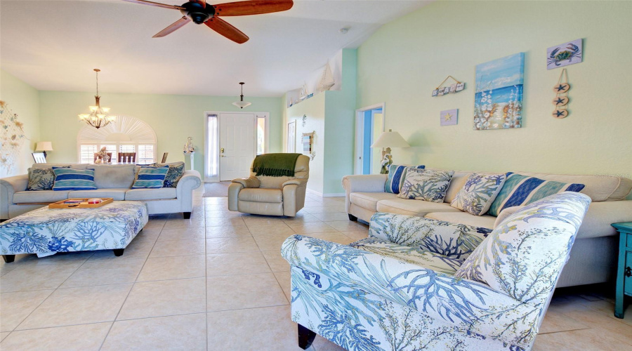 Great Room With Dining Room And Front Door In The Background