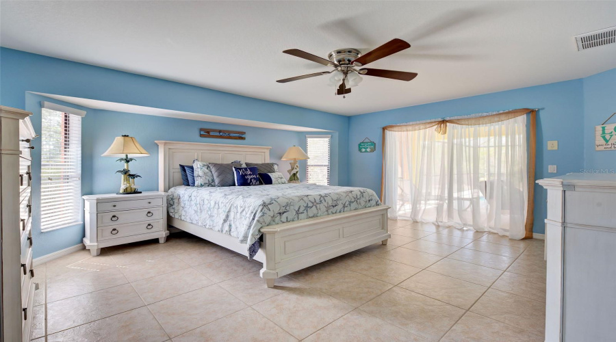 Primary Bedroom, Sliding Glass Doors To Pool/Lanai Area