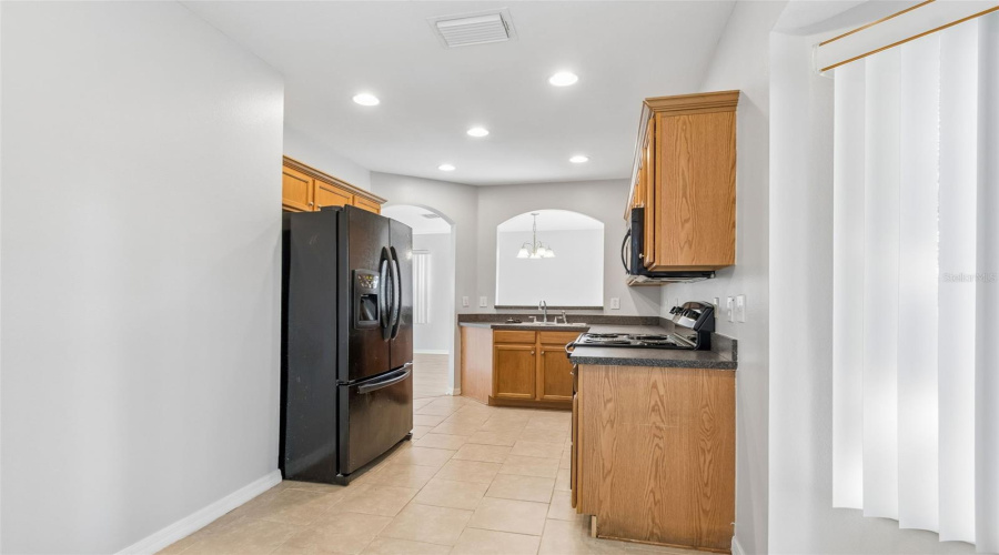 Kitchen Situated For Entertaining Dining Guests And In Dinette For Casual Dining.