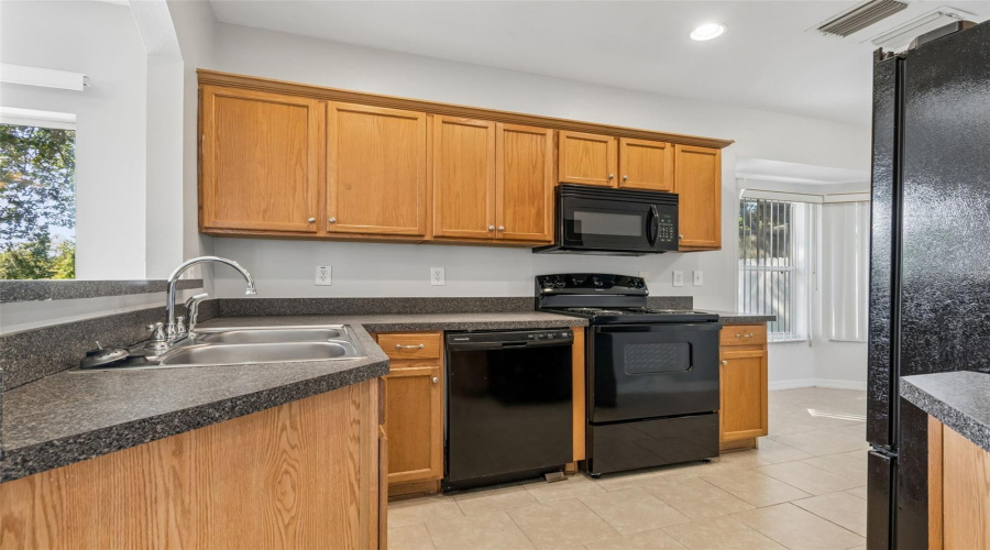 Brand New Stove And Garbage Disposal.