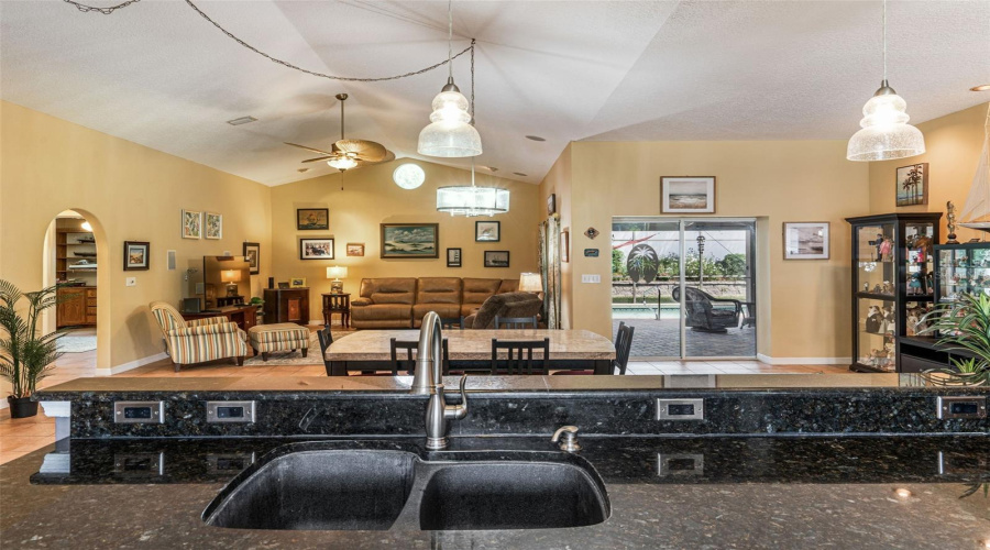 View From Kitchen To Greatroom, Dining And Patio/Pool Area.