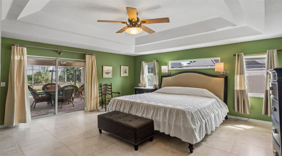 Large Primary Bedroom With Access To Patio.