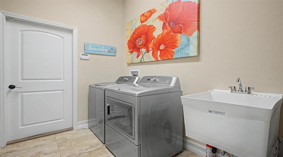 Walk In Laundry Room With Utility Sink