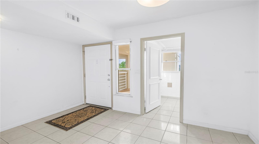 Front Door And Door To Laundry Room