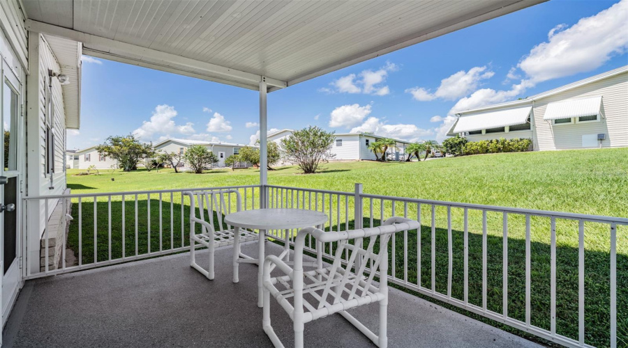 Back Covered Patio Overlooks Backyard