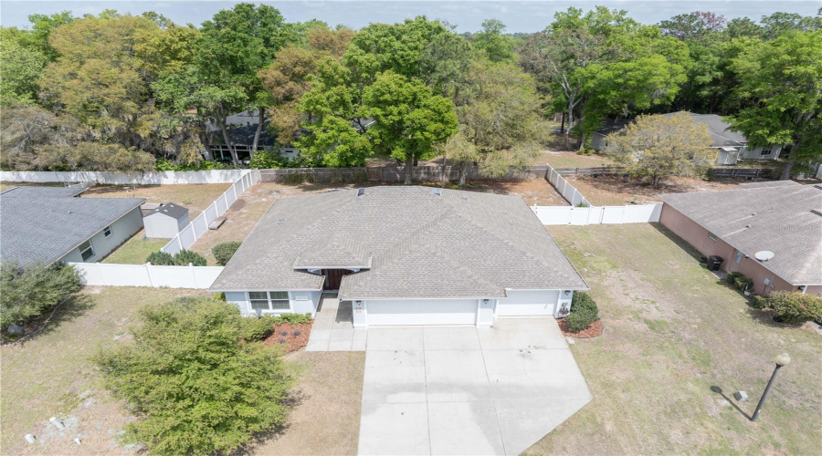 Front Of Home And Fenced Backyard