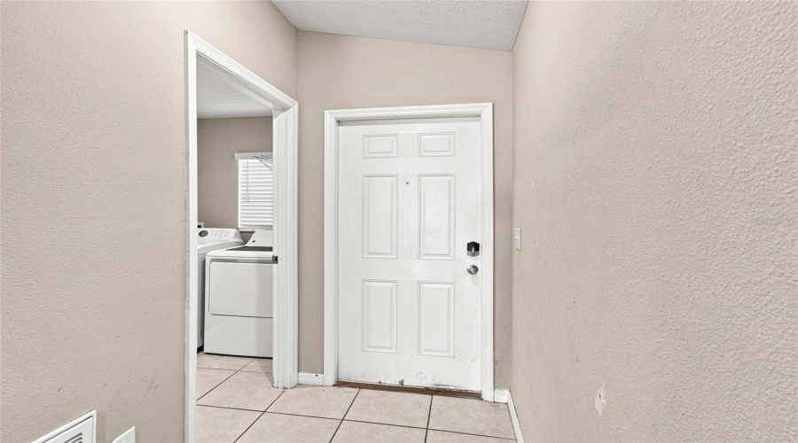 Front Door And Doorway To Laundry