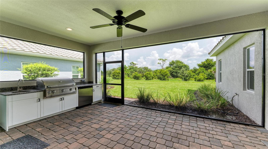Outdoor Kitchen Overlooking Preserve View.