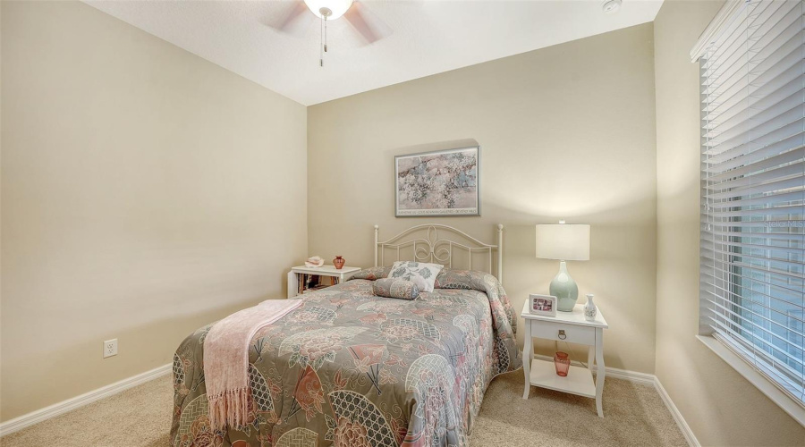 Guest Bedroom Thoughtfully Positioned Within The Split-Bedroom Floor Plan And Offers A Walk-In Closet