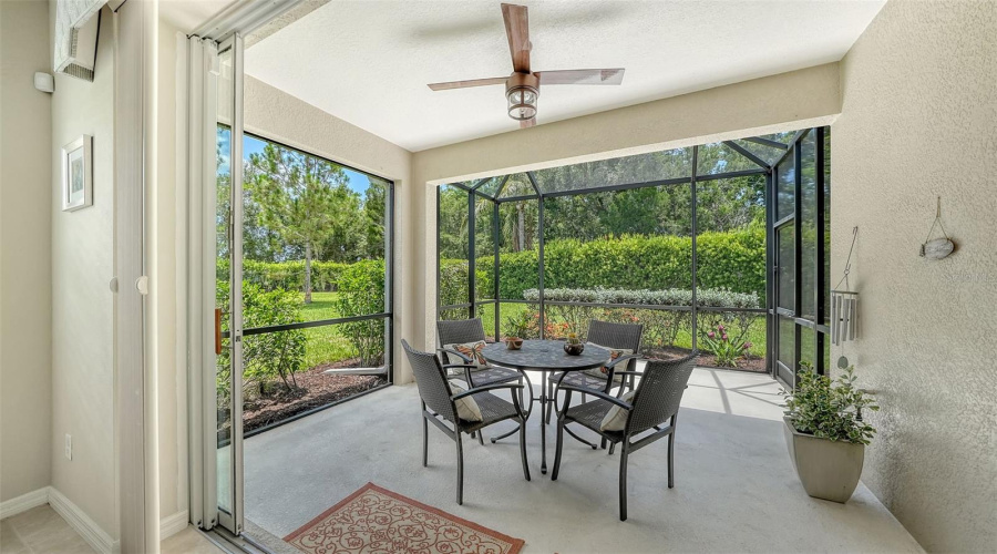 Pocketing Glass Doors Extend The Living Space Outdoors To A Generously Sized Covered And Screened Lanai Designed For Year-Round Enjoyment