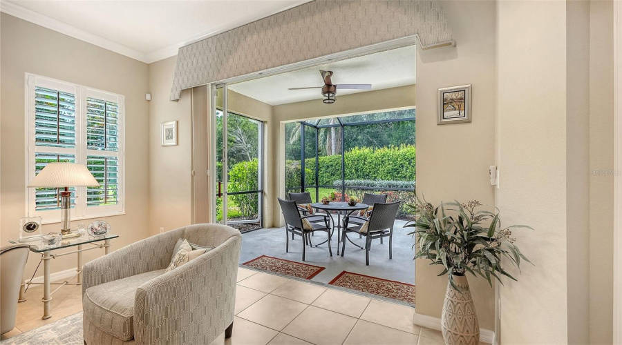 Expansive Pocketing Glass Doors That Seamlessly Connect The Interior To The Screened Lanai