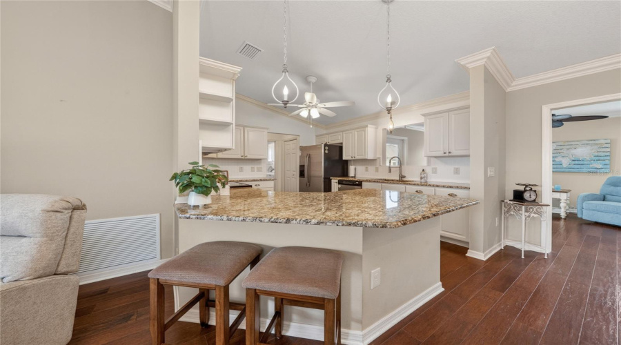 Kitchen Bar Seating With Open Flow To Living And Dining Areas