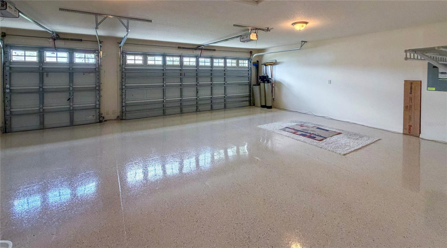 Spacious Garage With Epoxy-Coated Floor