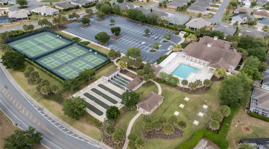 Aerial Showing Courts, Pool, And Parking At Captiva