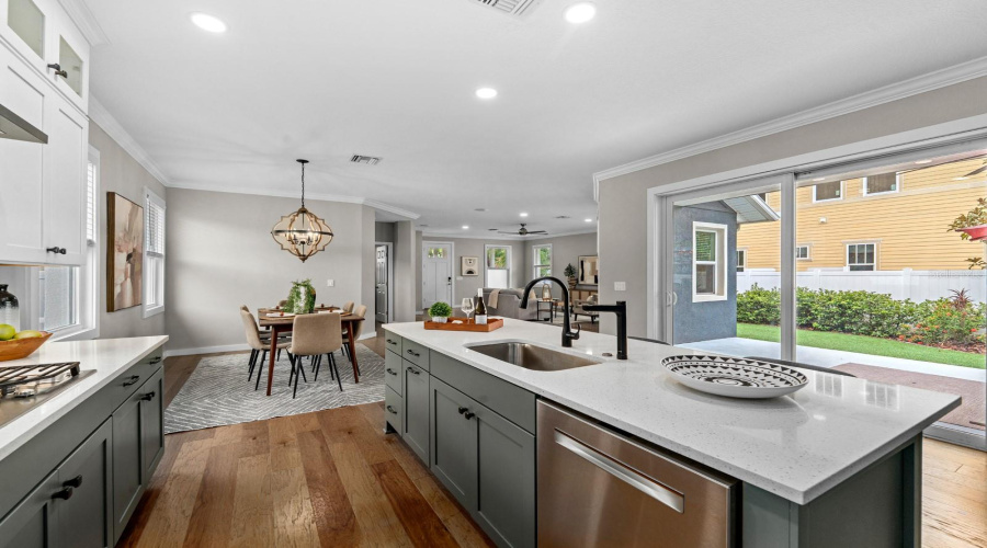 The Wall Of Sliding Glass Doors Lets The Light In And Makes Grilling Easy