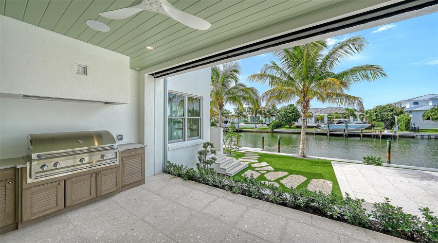 The Covered Outdoor Grilling Area Just Off The Kitchen With Retractable Screens