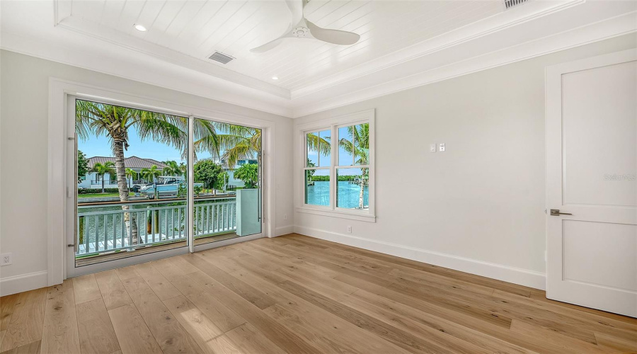 The First Level Primary Suite With Stunning Views And A Balcony With Steps Down To The Pool